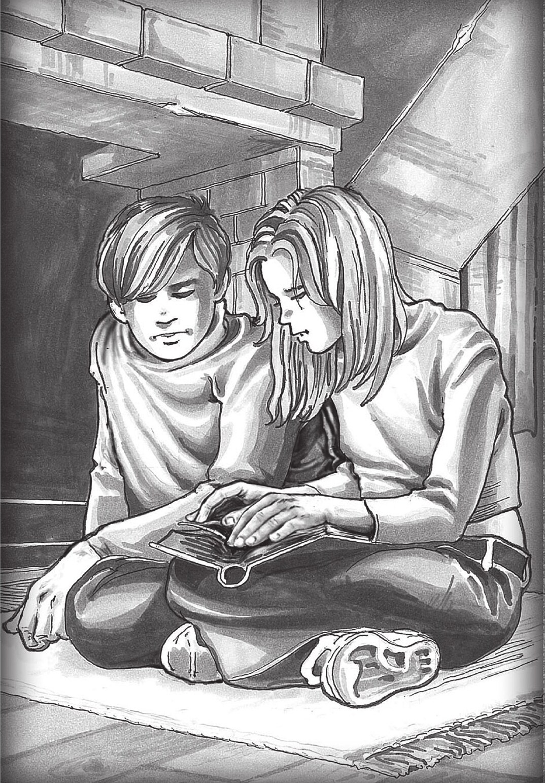 David and Abigael sitting together over an open book